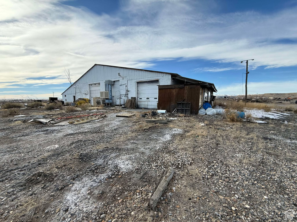 View of outbuilding with a garage