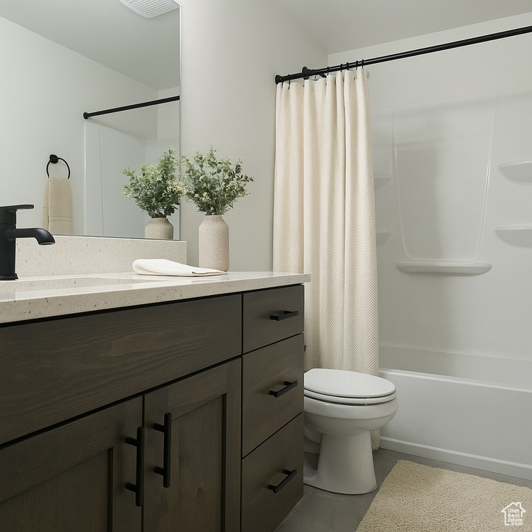 Full bathroom featuring visible vents, tile patterned flooring, shower / tub combo, vanity, and toilet