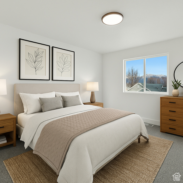 Carpeted bedroom with baseboards and visible vents