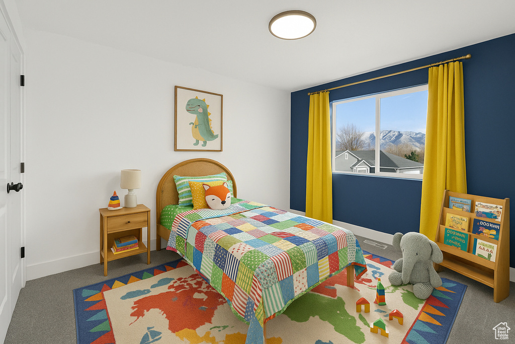 Carpeted bedroom featuring baseboards