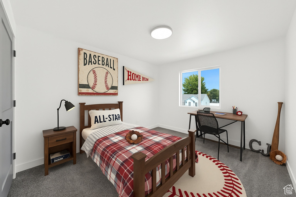 Carpeted bedroom with baseboards