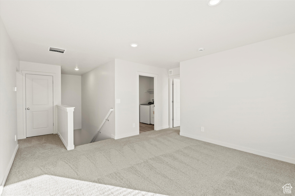 Carpeted spare room with recessed lighting