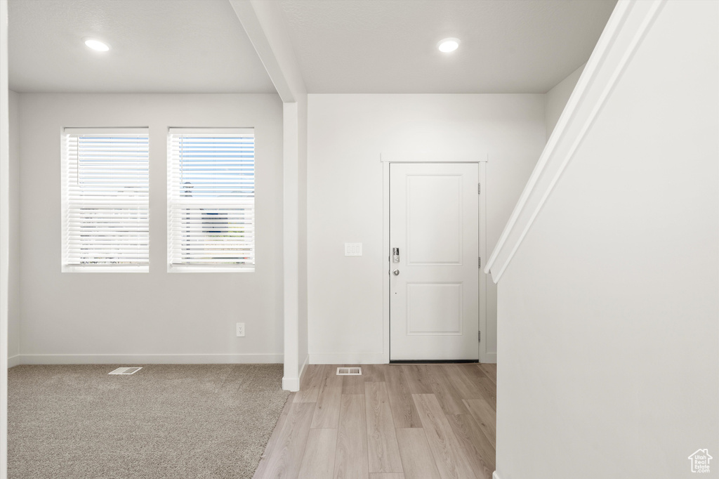 Entryway featuring light wood-style floors and recessed lighting