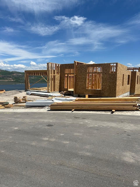 View of front of house with a water view