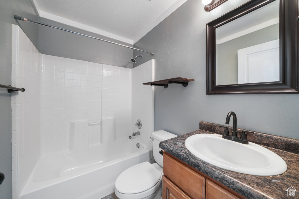 Full bathroom featuring shower / bathing tub combination, vanity, and toilet