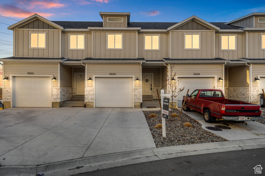 View of front of property featuring a garage