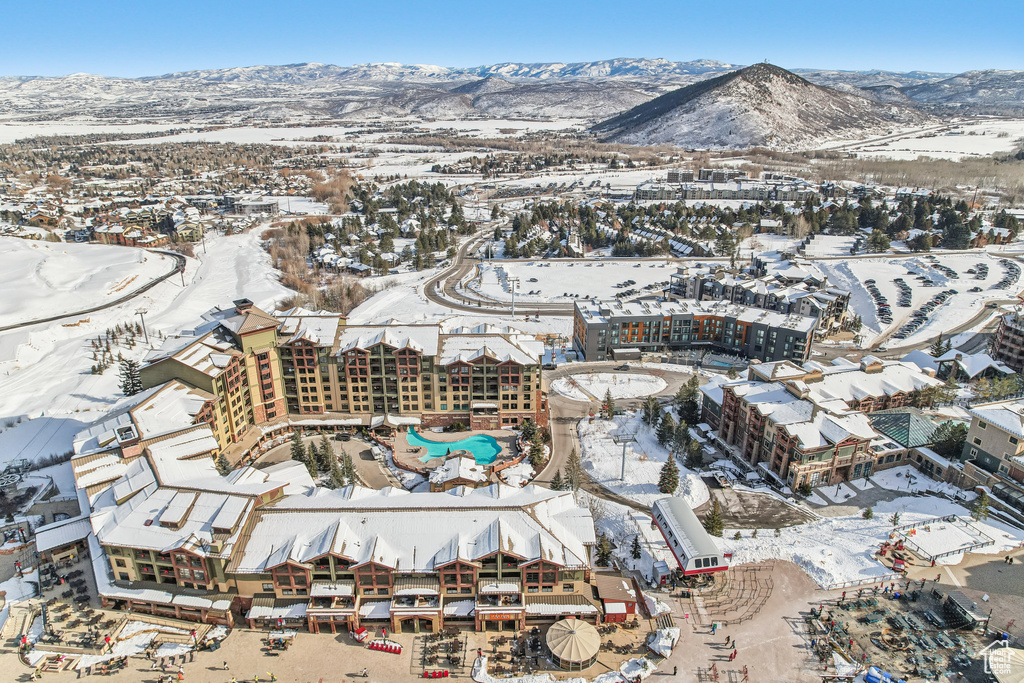 Snowy aerial view featuring a mountain view
