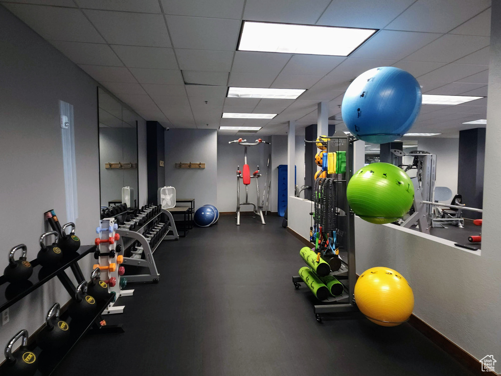 Exercise room featuring a drop ceiling