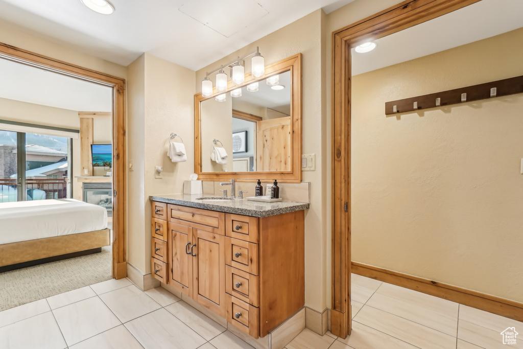 Bathroom featuring vanity and tile patterned floors
