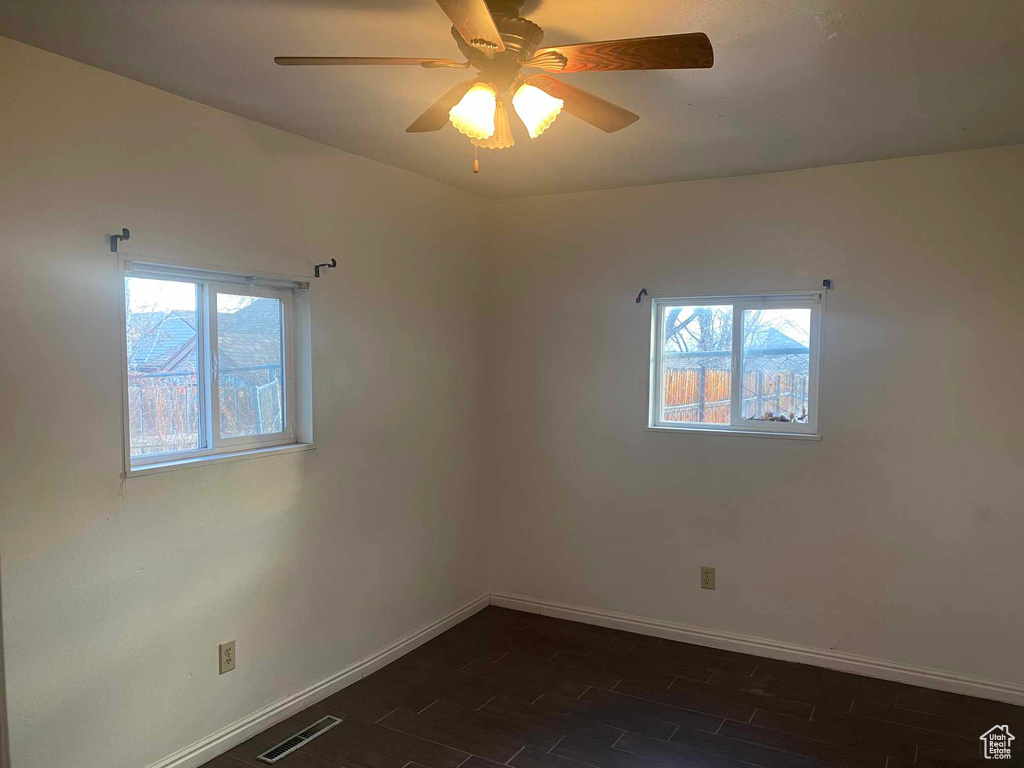 Empty room featuring ceiling fan