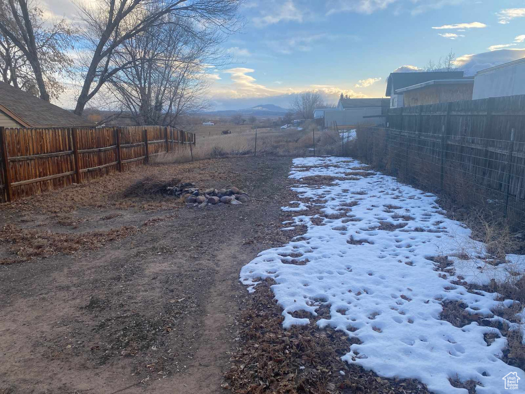 View of yard covered in snow