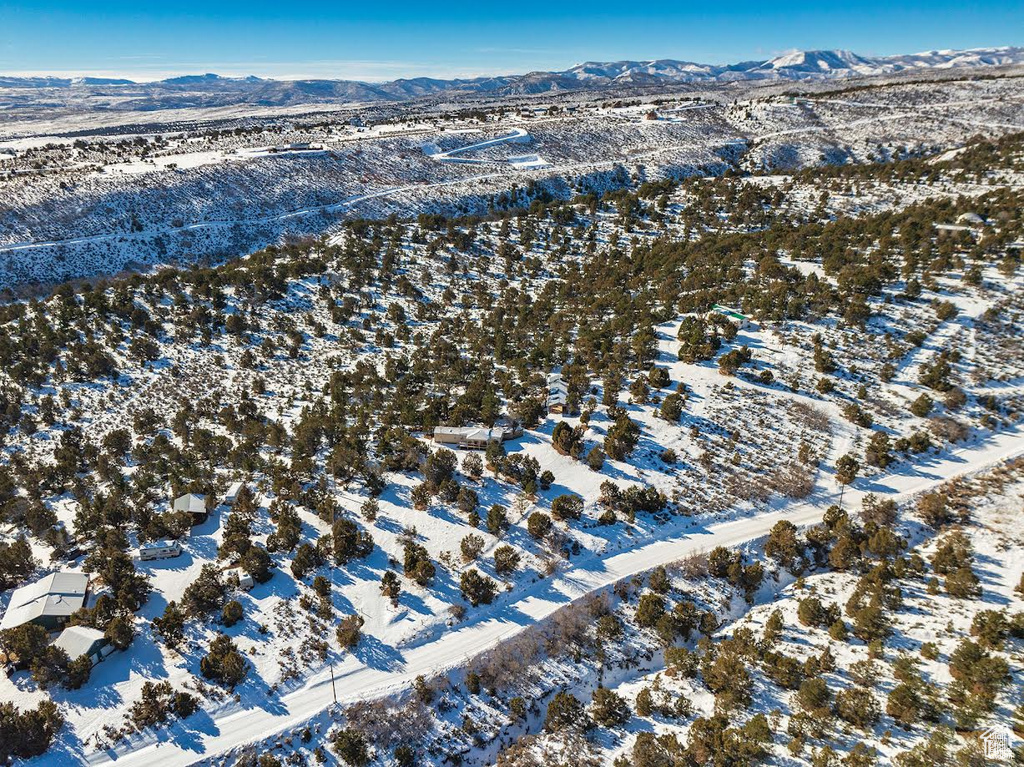 Snowy aerial view with a mountain view