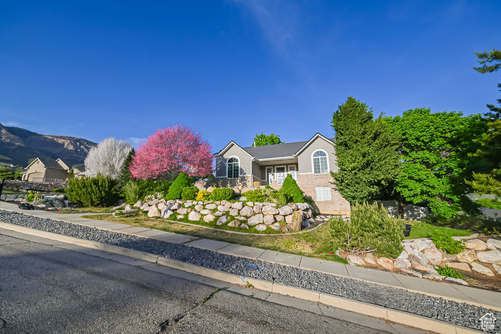 View of front of property featuring stucco siding and a mountain view