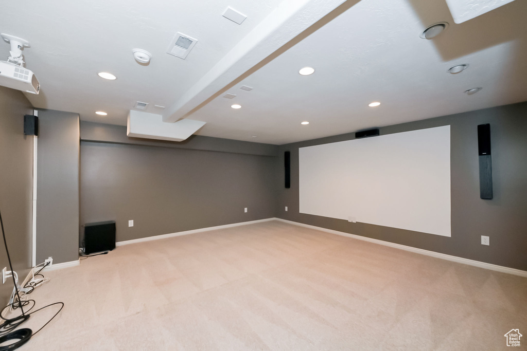 Cinema room with light carpet, recessed lighting, and baseboards