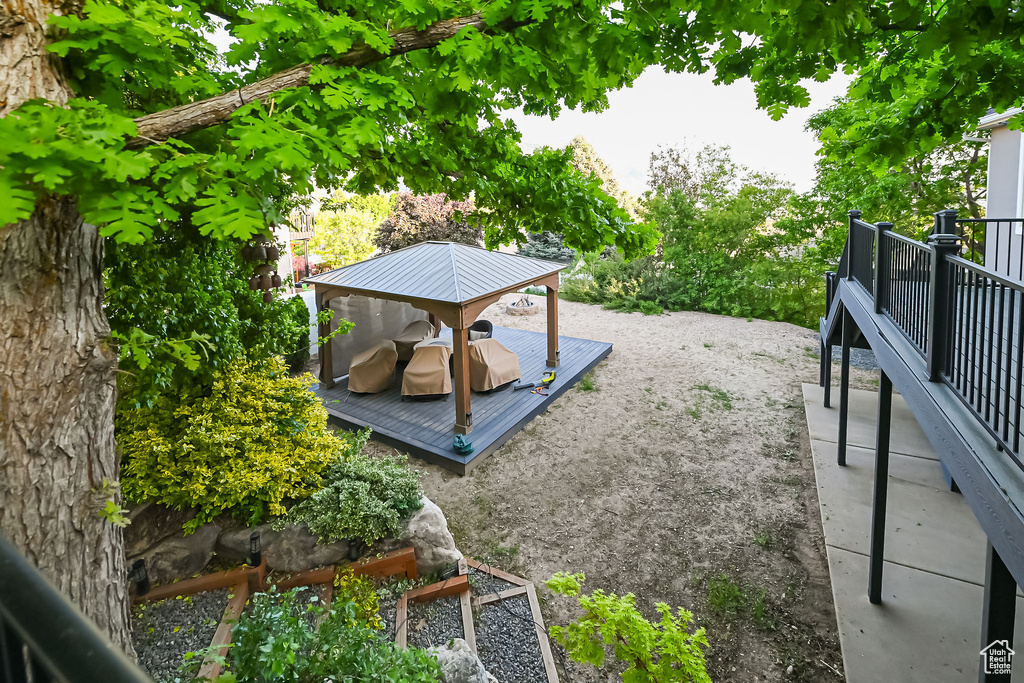 View of yard with a deck and a gazebo