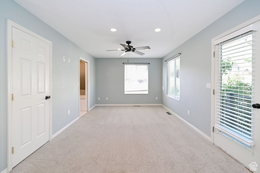 Unfurnished room with baseboards, light carpet, recessed lighting, and ceiling fan