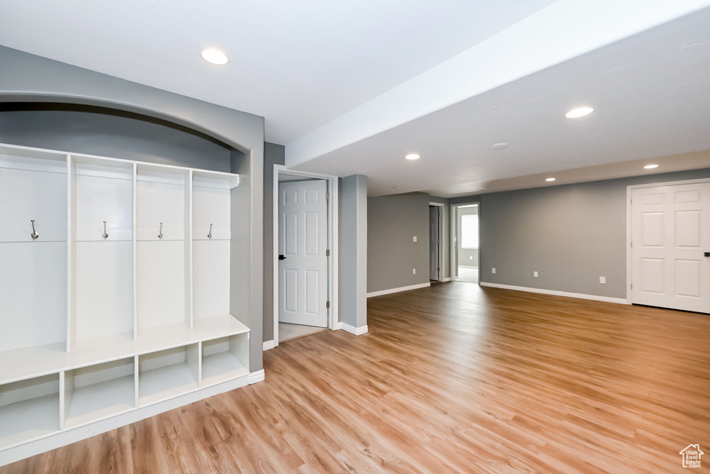 Mudroom featuring light wood-style floors, baseboards, and recessed lighting