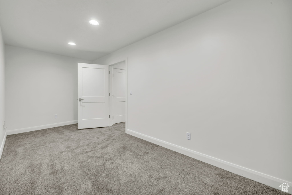 Unfurnished room featuring recessed lighting, carpet flooring, and baseboards