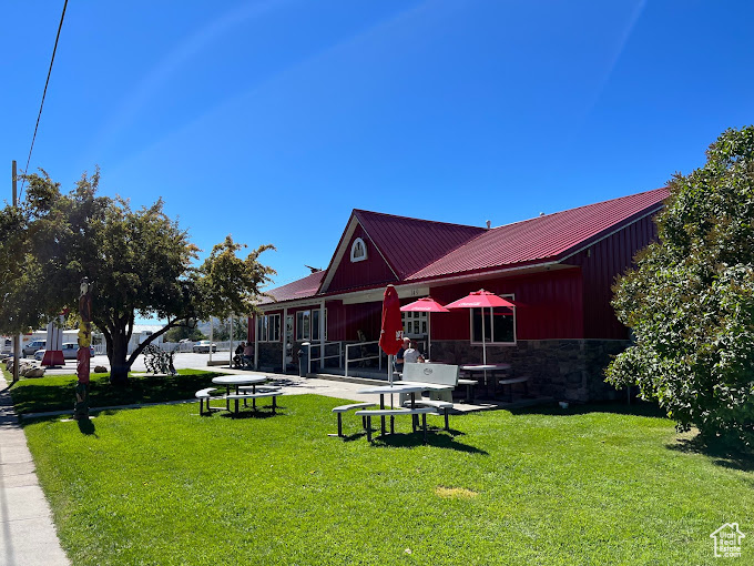 View of property's community with a yard