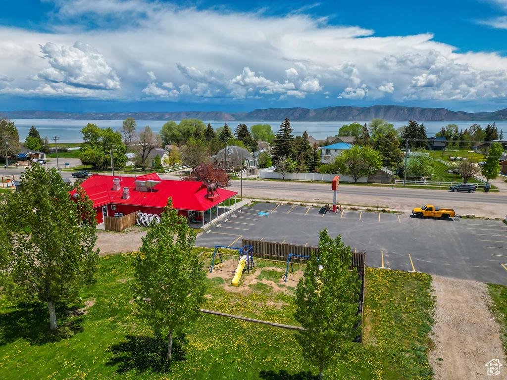 Drone / aerial view featuring a water and mountain view