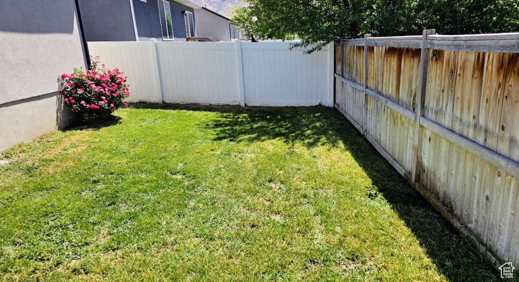 View of fenced backyard