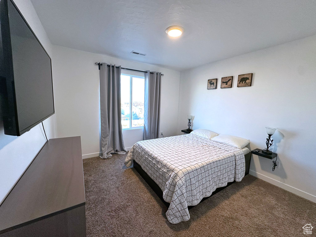 View of carpeted bedroom