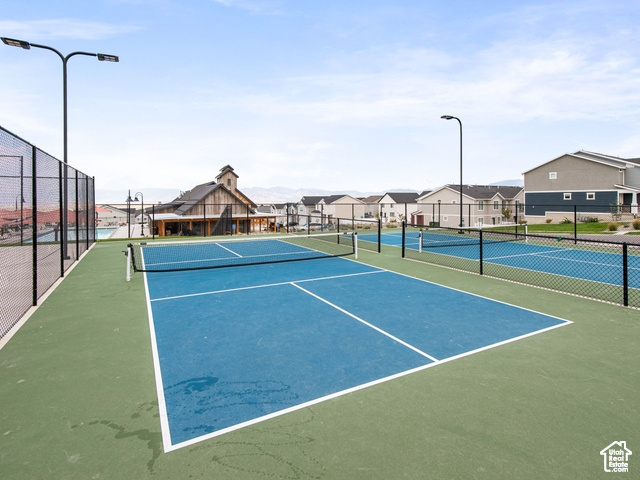 View of tennis court with basketball court