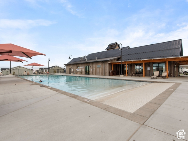 View of pool featuring a patio area