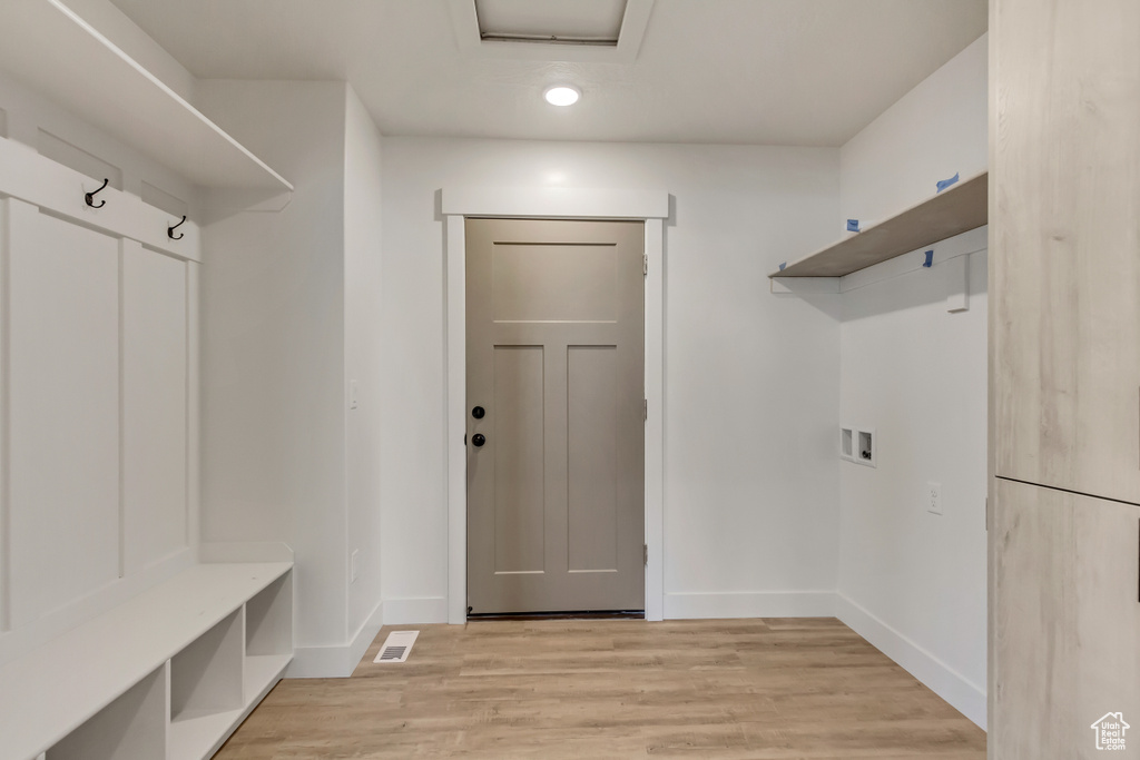 Mudroom with light wood-type flooring