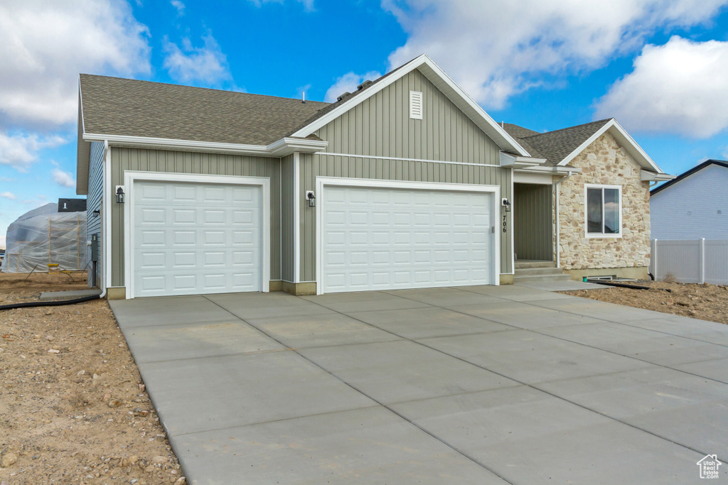 View of front of property featuring a garage