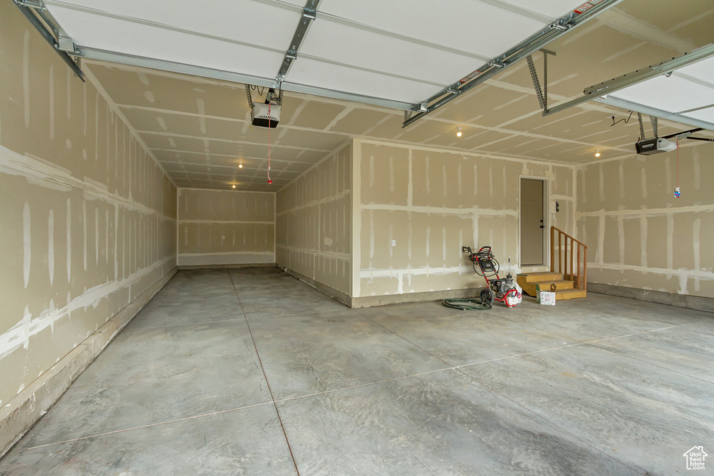 Garage featuring a garage door opener