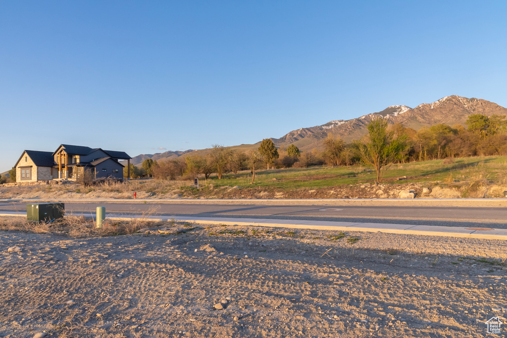 Exterior space with curbs and a mountain view