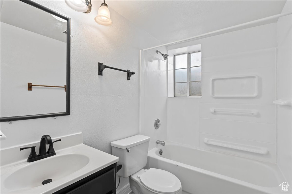 Full bathroom with vanity, toilet, and shower / washtub combination