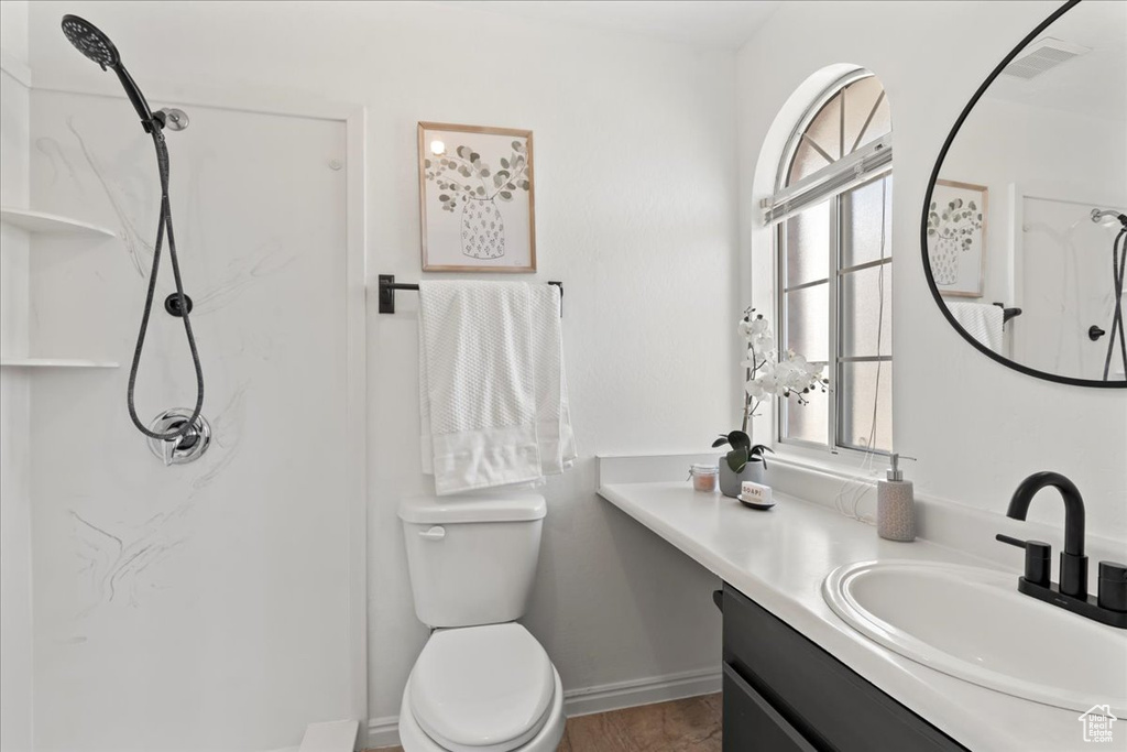 Bathroom with vanity and toilet