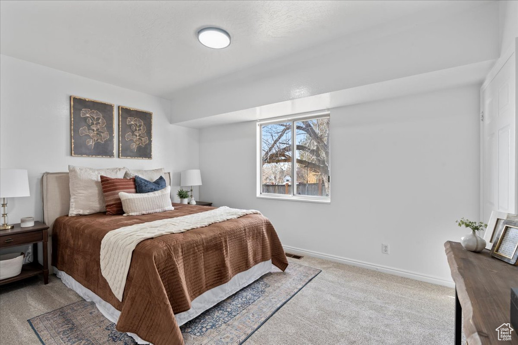 Bedroom with carpet flooring