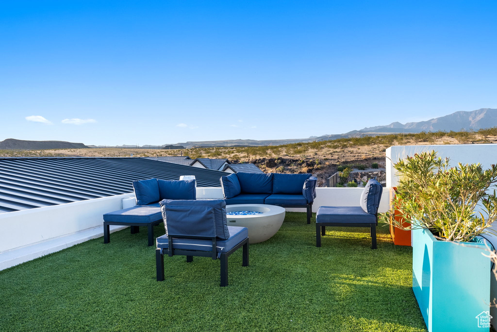 View of yard with a mountain view and outdoor lounge area