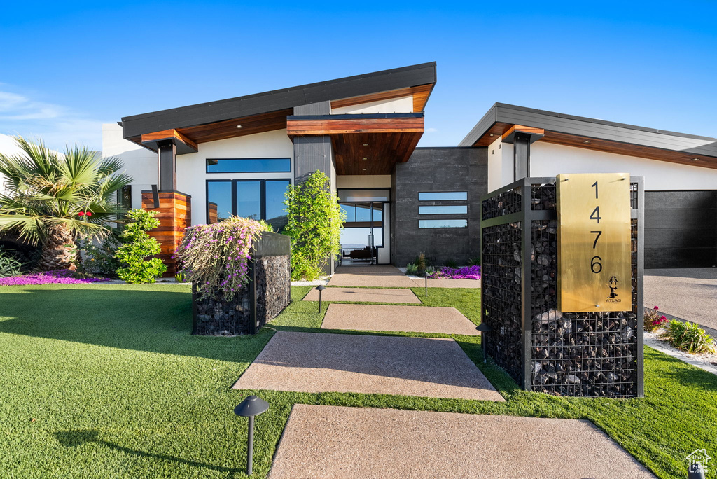View of front of property with a front yard