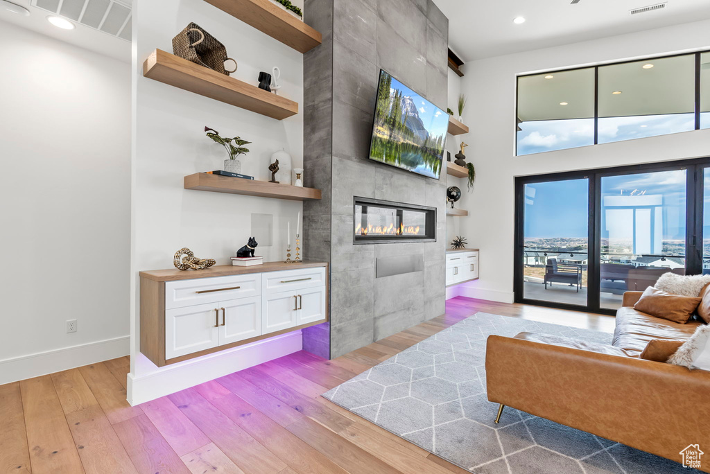 Living room featuring a fireplace and light hardwood / wood-style flooring