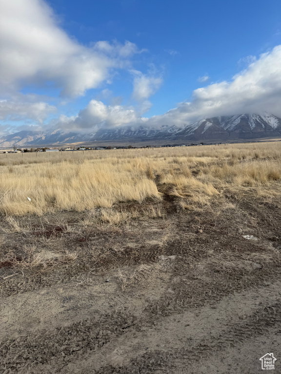 Property view of mountains with a rural view