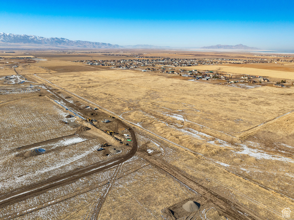 Birds eye view of property with a mountain view and a rural view