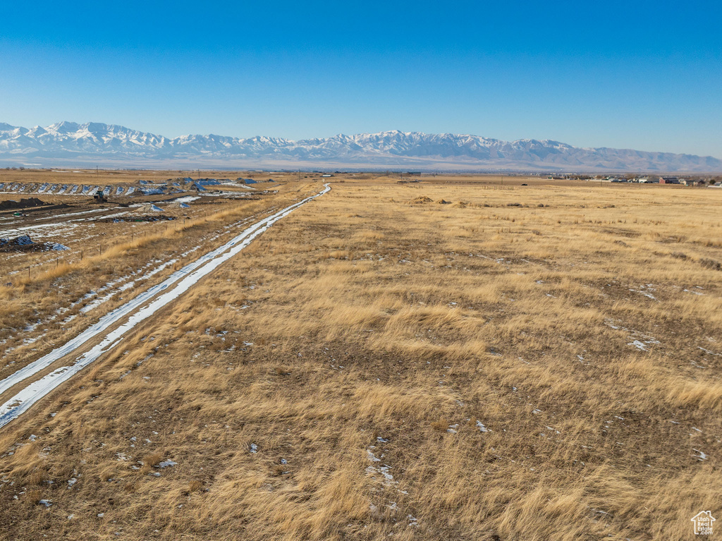 Birds eye view of property with a rural view and a mountain view