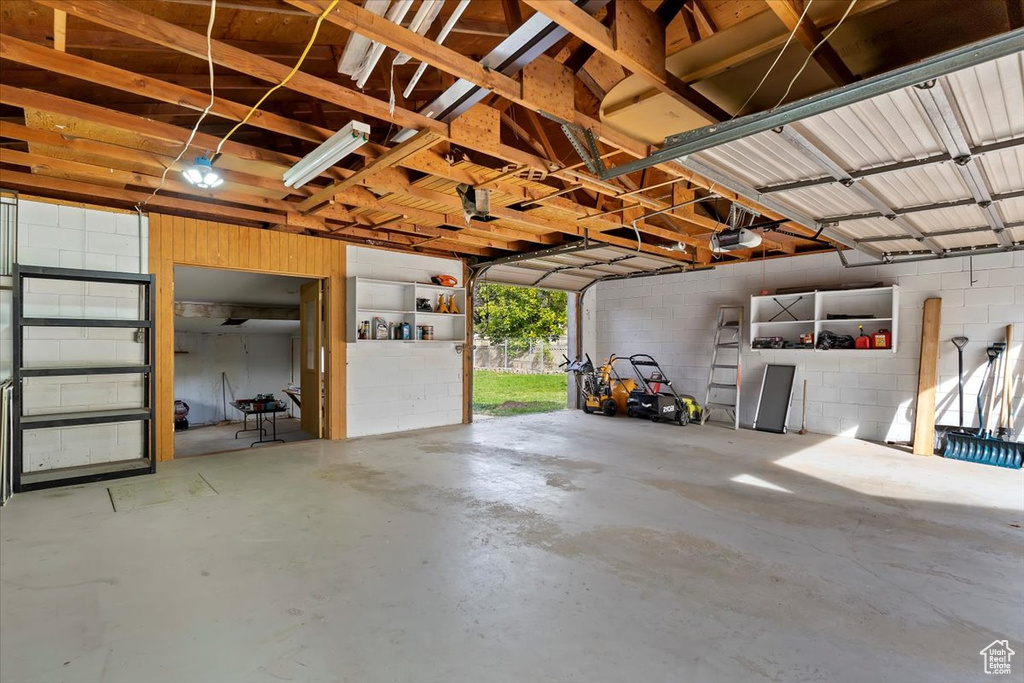 Garage featuring a garage door opener