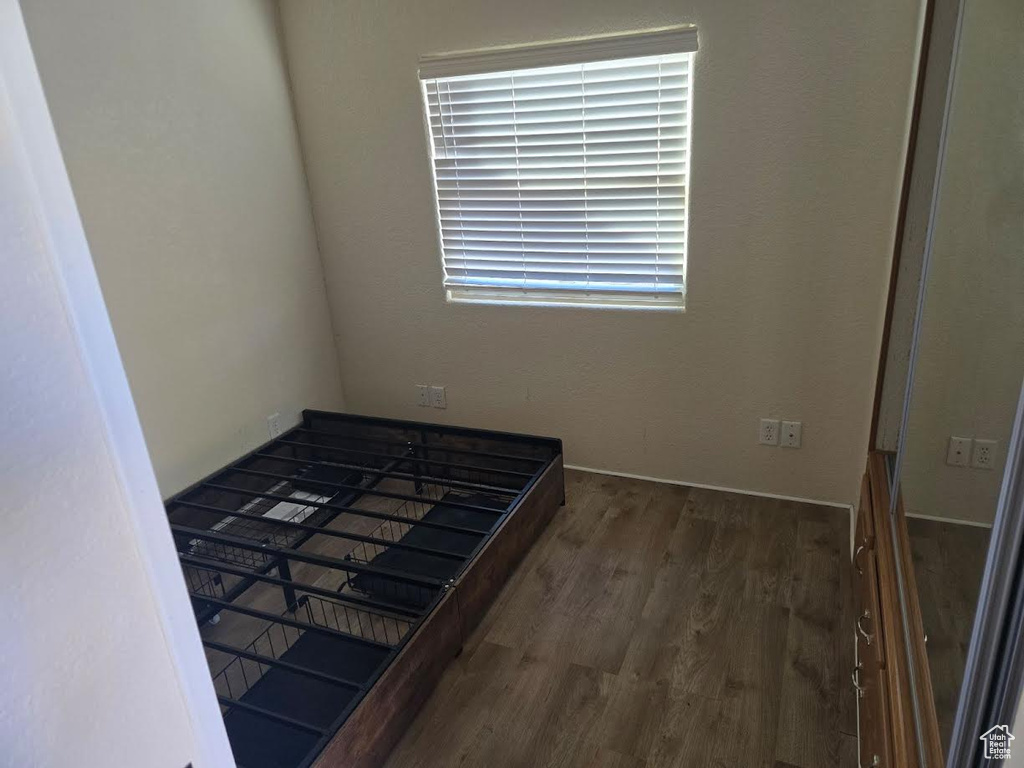 Bedroom featuring dark hardwood / wood-style flooring