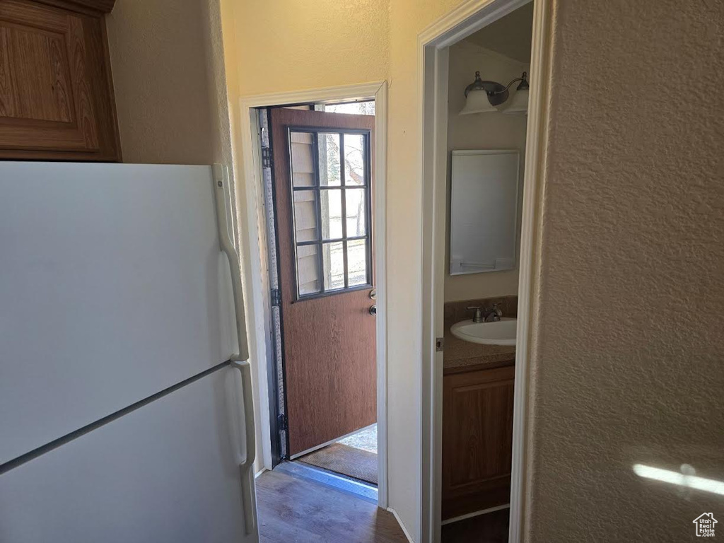 Interior space with white refrigerator and sink