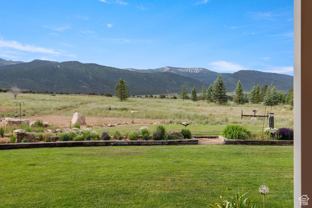 View of mountain backdrop featuring rural landscape and agricultural land