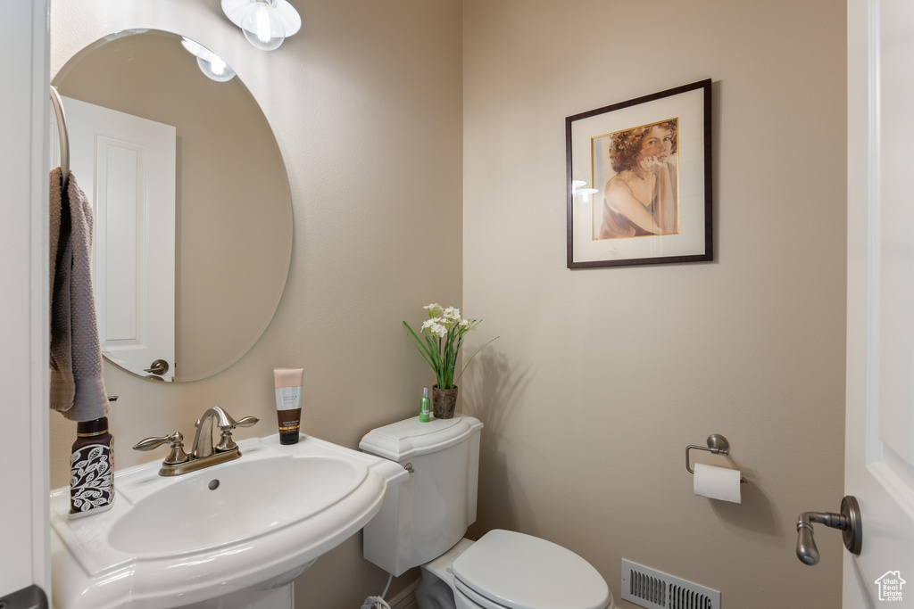 Bathroom with a sink and toilet