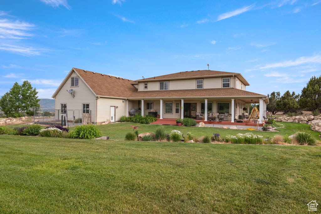 Back of property featuring a porch
