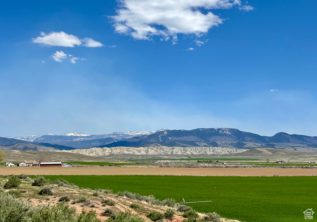 Property view of mountains with a rural view