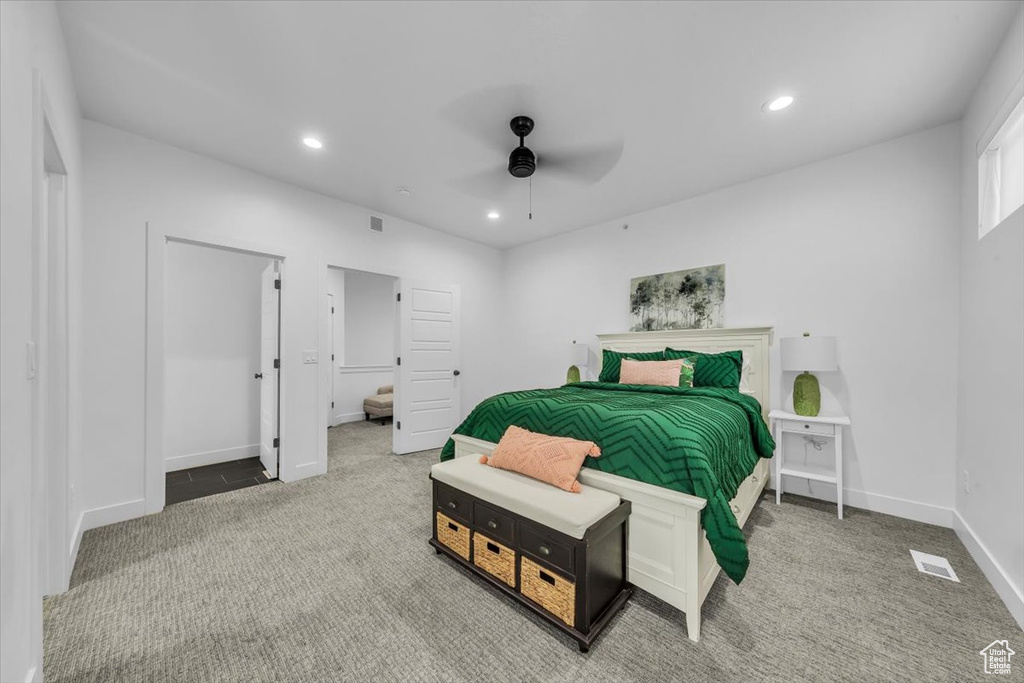 Carpeted bedroom with recessed lighting, visible vents, baseboards, and a ceiling fan