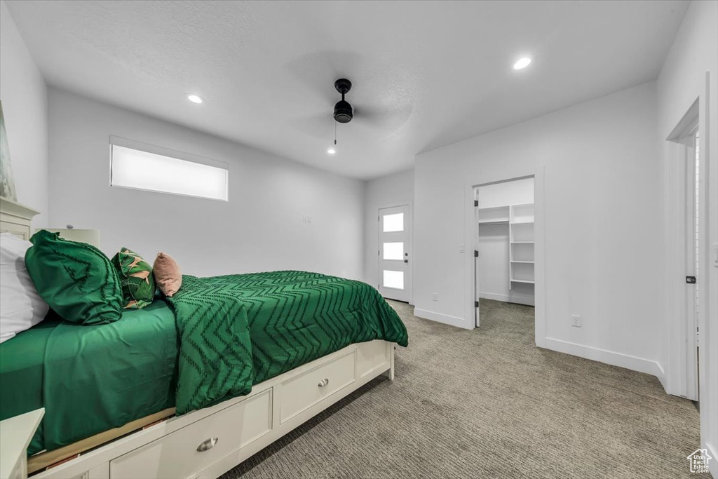 Bedroom featuring recessed lighting, light colored carpet, baseboards, and multiple windows